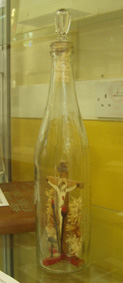 The crucifix in the bottle